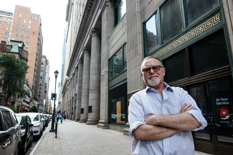 Bill Whiting, one of the former Wanamakers employees who is missing his pension, poses outside the iconic former department store, now a Macy's, on Chestnut Street.